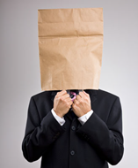 Embarrassed man with bag over head