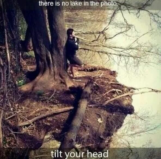 Man standing by a lake is an optical illusion